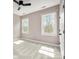 Bedroom with plush carpet, neutral walls, and ample natural light from two windows at 11001 Valley Spring Dr, Charlotte, NC 28277