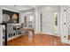 Elegant dining room with hardwood floors, a bay window, and a modern pendant light at 11001 Valley Spring Dr, Charlotte, NC 28277