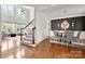 Elegant foyer with a staircase, hardwood floors, and dining area with stylish decor at 11001 Valley Spring Dr, Charlotte, NC 28277