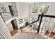 Open foyer overlooking a living area with a fireplace and large windows at 11001 Valley Spring Dr, Charlotte, NC 28277
