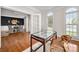 Well-lit home office near the dining room featuring a decorative table and chair at 11001 Valley Spring Dr, Charlotte, NC 28277