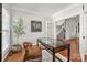 Office space with hardwood floors, a view to the stairs, and decorative shelving at 11001 Valley Spring Dr, Charlotte, NC 28277