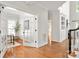 Bright office featuring hardwood floors, glass doors, and built-in bookshelves at 11001 Valley Spring Dr, Charlotte, NC 28277