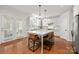 Open kitchen area featuring a large island with seating, pendant lights, and lots of countertop space at 11001 Valley Spring Dr, Charlotte, NC 28277