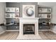 Close up of the living room fireplace with built-in shelves and stylish decor in a cozy living space at 11001 Valley Spring Dr, Charlotte, NC 28277