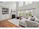 Bright living room with large windows, fireplace, built-in shelves, and comfortable sectional sofa at 11001 Valley Spring Dr, Charlotte, NC 28277