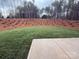 Secluded backyard featuring manicured landscaping, a patio, and mature trees at 12027 Mariners Cove Ct # 381, Lancaster, SC 29720