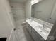Bright bathroom with double sink vanity, modern fixtures, and a large mirror at 12027 Mariners Cove Ct # 381, Lancaster, SC 29720