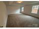 Spacious carpeted main bedroom with a large closet and ample natural light at 12027 Mariners Cove Ct # 381, Lancaster, SC 29720