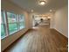 Bright and airy dining room area with large windows and wood-look flooring at 12027 Mariners Cove Ct # 381, Lancaster, SC 29720