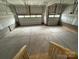 Spacious three car garage with concrete floor and multiple garage door openers at 12027 Mariners Cove Ct # 381, Lancaster, SC 29720