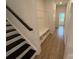 Hallway featuring custom bench with storage and access to upper level at 12027 Mariners Cove Ct # 381, Lancaster, SC 29720