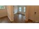 Open-concept view of living room and dining with hardwood flooring and trim at 12027 Mariners Cove Ct # 381, Lancaster, SC 29720