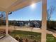 Scenic view of a neighborhood and lake from a covered porch, offering a glimpse of community and nature at 12027 Mariners Cove Ct # 381, Lancaster, SC 29720