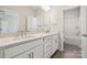 Bright bathroom with double sink vanity, granite countertops, and glass enclosed shower at 177 Glenn Dr, Mooresville, NC 28115
