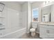 Bright bathroom featuring a shower-tub combo, toilet, and vanity with granite countertop at 177 Glenn Dr, Mooresville, NC 28115
