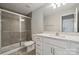 Bathroom featuring a glass shower, commode, vanity with granite countertop and tile floors at 177 Glenn Dr, Mooresville, NC 28115