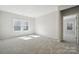 Bedroom with carpeted flooring, neutral walls, and abundant natural light at 177 Glenn Dr, Mooresville, NC 28115