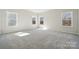 Bright bedroom with carpeted floors and plenty of natural light at 177 Glenn Dr, Mooresville, NC 28115