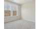 Bright bedroom with large windows and neutral carpet at 177 Glenn Dr, Mooresville, NC 28115