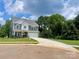 Charming two-story home featuring gray siding, stone accents, and a two car garage at 177 Glenn Dr, Mooresville, NC 28115