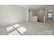Spacious living room with natural light and neutral carpet at 177 Glenn Dr, Mooresville, NC 28115
