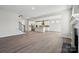 Spacious living room featuring hardwood floors and an open floor plan with stainless steel appliances at 177 Glenn Dr, Mooresville, NC 28115