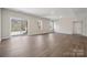 Spacious living room featuring wood floors, sliding glass door to the outside, and natural light at 177 Glenn Dr, Mooresville, NC 28115