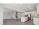 Open living area with hardwood floors leading to the kitchen and staircase at 177 Glenn Dr, Mooresville, NC 28115