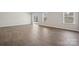 Light filled living area featuring modern wood floors and sliding door to the patio at 177 Glenn Dr, Mooresville, NC 28115