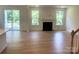 Inviting living room features a fireplace, large windows, and access to the outdoor patio at 177 Glenn Dr, Mooresville, NC 28115