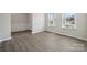 Well-lit office area with wainscoting, natural light, and hardwood flooring at 177 Glenn Dr, Mooresville, NC 28115