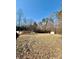 View of the backyard with a shed and swimming pool at 191 Ashford Dr, Olin, NC 28660