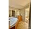 Bathroom with a garden tub, tile floors, and vanity sink at 191 Ashford Dr, Olin, NC 28660