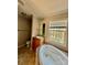 Cozy bathroom showing a large tub, toilet, and a vanity with sink at 191 Ashford Dr, Olin, NC 28660