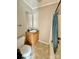 Modest bathroom featuring a single sink vanity and a shower-tub combo with a blue curtain at 191 Ashford Dr, Olin, NC 28660