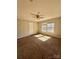 Bedroom featuring carpet floors and abundant natural light from the two windows at 191 Ashford Dr, Olin, NC 28660