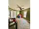 Green bedroom with carpet, ceiling fan and a small play tent at 191 Ashford Dr, Olin, NC 28660