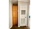 Hallway with wood cabinets and a door with built-in vents at 191 Ashford Dr, Olin, NC 28660