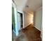 View down hallway to rooms in home with brown carpet at 191 Ashford Dr, Olin, NC 28660
