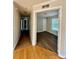 Hallway showing hardwood floors on one side and carpet on the other at 191 Ashford Dr, Olin, NC 28660