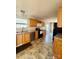 Cozy kitchen with wood cabinets, stainless steel appliances, and a view into the dining area at 191 Ashford Dr, Olin, NC 28660