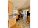 Functional kitchen with wood cabinets, black appliances, and tile flooring for easy maintenance at 191 Ashford Dr, Olin, NC 28660