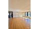 Bright living room with wood floors, a ceiling fan, and a view leading to the kitchen at 191 Ashford Dr, Olin, NC 28660