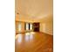 Spacious living room featuring wood floors, a stone fireplace, and natural light from the windows at 191 Ashford Dr, Olin, NC 28660