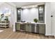 Chic bar area features custom cabinetry, a wine fridge, and a sink, perfect for entertaining in style at 19419 Youngblood W Rd # 2, Charlotte, NC 28278
