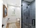 Cozy bathroom with modern shower, framed mirror and white painted wainscotting at 19419 Youngblood W Rd # 2, Charlotte, NC 28278