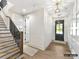 Welcoming entryway featuring hardwood floors, staircase, and contemporary lighting fixtures at 19419 Youngblood W Rd # 2, Charlotte, NC 28278