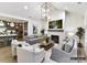 Inviting living room features neutral tones, a cozy fireplace, and seamless integration with the kitchen at 19419 Youngblood W Rd # 2, Charlotte, NC 28278