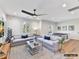 Spacious living room perfect for entertaining, with large sofas, lighting, and a ping pong table at 19419 Youngblood W Rd # 2, Charlotte, NC 28278